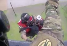 Helicopter Pulls Man From Water, That’s When Rescuers Spot Tiny Dog Held Tightly In His Arms